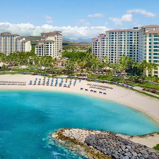 Aerial view of Marriott's Ko Olina Beach Club's beachfront and resort on a sunny day